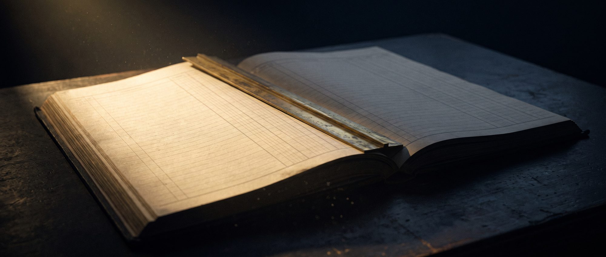 A long ledger table under one low lamp, ruled columns running away into darkness